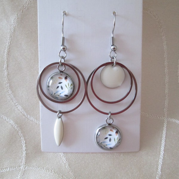 Boucles d'oreilles asymétrique en acier argenté sequin blanc