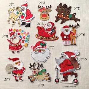 May include: A selection of embroidered Christmas patches, showcasing Santa Claus and reindeer in diverse designs. Santa is dressed in a red suit and hat, and the reindeer are adorned with festive details. The patches are numbered for identification.