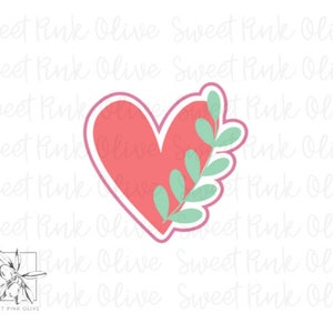 May include: A pink heart with a green leafy branch design. The heart is outlined in a darker pink.