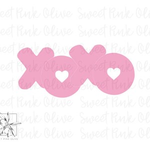 May include: Pink XOXO cutouts with a heart in the center of the "O".