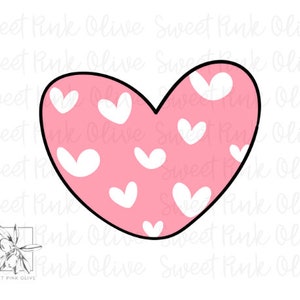 May include: A pink heart-shaped cookie cutter with a white heart pattern.