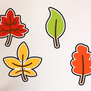 May include: Four colorful fall leaves with brown stems. The leaves are red, orange, yellow, and green.