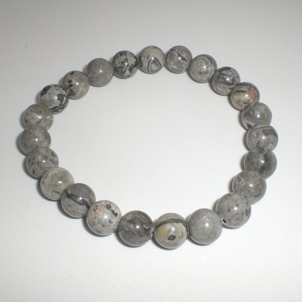 Beau bracelet homme ou femme en perles gris moucheté sur élastique