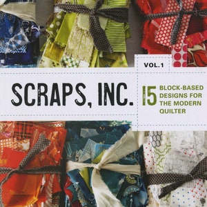 May include: Book cover with the title "Scraps, Inc. 15 Block-Based Designs for the Modern Quilter" and a colorful image of fabric scraps tied together with ribbon.
