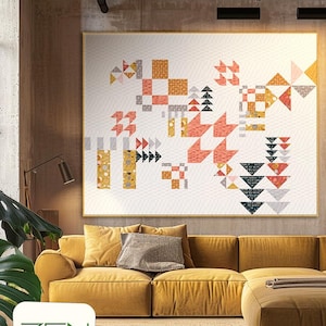 May include: A modern living room interior with a yellow sectional sofa and a large framed quilt hanging on the wall. The quilt is made of various geometric shapes in shades of pink, orange, yellow, and gray. The text "ZEN CHIC" and "BRIGITTE HEITLAND" is printed on a square label in the lower left corner of the image. The text "BREEZE" is printed in white on a gray background in the lower right corner of the image.