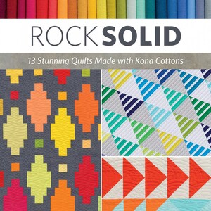 May include: A book cover with the title "Rock Solid" and the subtitle "13 Stunning Quilts Made with Kona Cottons". The cover features a colorful patchwork quilt design with geometric shapes.