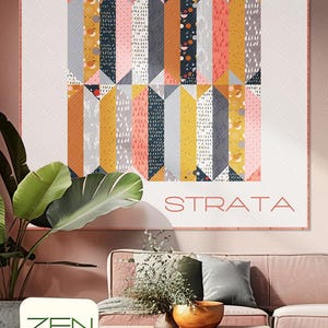 May include: A quilt pattern called "Strata" by Zen Chic, designed by Brigitte Heitland. The quilt features a geometric pattern of colorful fabric strips in shades of pink, yellow, gray, and black.