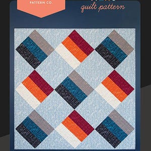 May include: A quilt pattern titled "Three Tiers" by Ruby Star Society. The pattern features a geometric design with a variety of colors, including red, orange, white, gray, blue, and black. The quilt is 57 inches by 57 inches.
