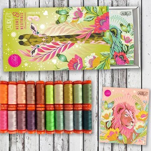 May include: A set of 18 spools of Aurifil thread in a variety of colors, including neon and neutral shades. The spools are arranged in a row and are labeled with the Aurifil logo and the color name. The thread is made in Italy and is 100% cotton.