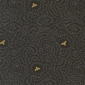 May include: Dark gray fabric with a repeating pattern of white radial lines and gold-colored bee or butterfly shapes. The design creates a textured, organic feel, suitable for various craft projects.