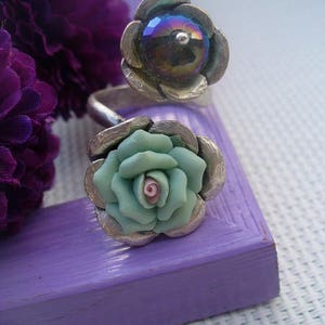 Green, iridescent silver ring