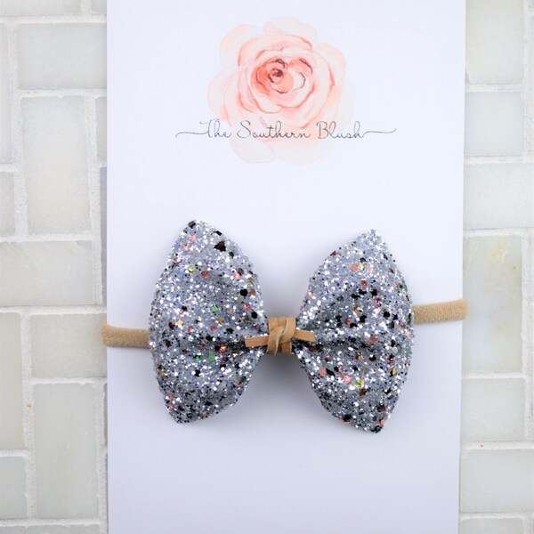 ISLA and ELLIE- Silver glitter with green- blush and bronze specks baby bow on nylon headband or clip with suede tie