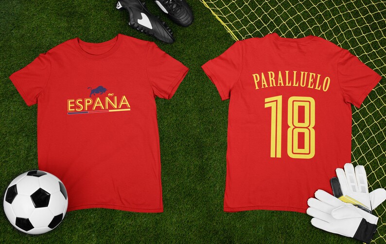 May include: Red soccer jersey with the word "ESPA&Ntilde;A" and a bull graphic on the front and the name "PARALLUELO" and the number "18" on the back.