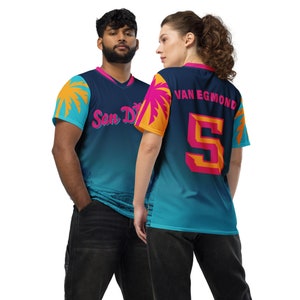 May include: Two people wearing blue and teal athletic jerseys with a palm tree design. The jersey on the left says "San Di" and the jersey on the right says "Van Egmond 5".