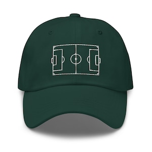 May include: A dark green baseball cap with a white embroidered outline of a football pitch.
