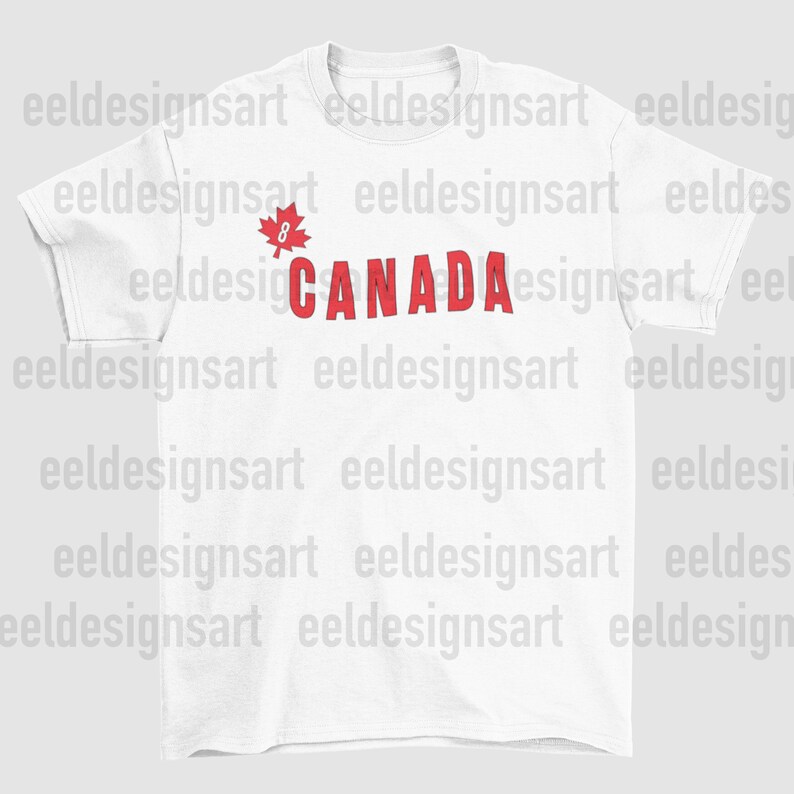 May include: White t-shirt with the word "CANADA" in red, accompanied by a red maple leaf graphic. This casual crew neck tee is ideal for everyday wear. The design is simple and striking, a great way to show support for Canada.