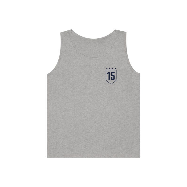 May include: A gray sleeveless tank top with a navy blue embroidered shield featuring the number 15 and five stars.