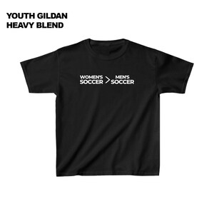 May include: Black t-shirt with white text that reads "Women's Soccer > Men's Soccer".