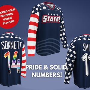 May include: Three blue hockey jerseys with white stars and red and white stripes. The jerseys have the names "Sonnett", "Smith", and "STATES" on the back. The number "14" is on the Sonnett jersey, the number "11" is on the Smith jersey, and the number "14" is on the Sonnett jersey. The jerseys are on a blue background.