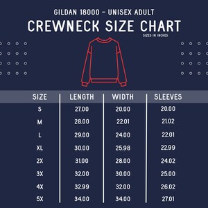 May include: A size chart for Gildan 18000 unisex adult crewneck sweatshirts. The chart shows the length, width, and sleeve measurements in inches for sizes S through 5X.