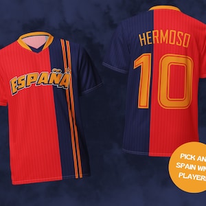 May include: A red and blue soccer jersey with the word "ESPA&Ntilde;A" on the front and the number "10" and the name "HERMOSO" on the back.