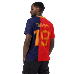 May include: A blue and red soccer jersey with the name "CARMONA" and the number "19" printed on the back.