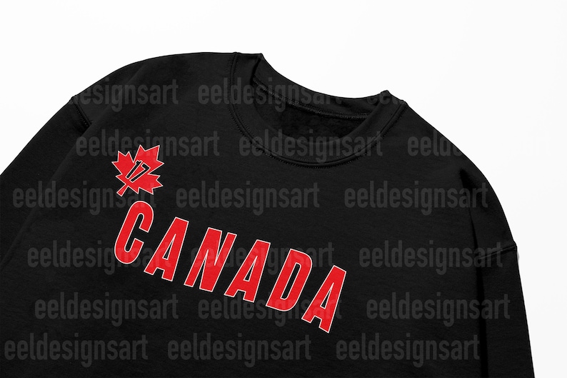 May include: Black sweatshirt with a red maple leaf and the word "CANADA" in red letters.