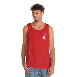 May include: Red sleeveless tank top with a white embroidered shield featuring the number 16 and five stars.