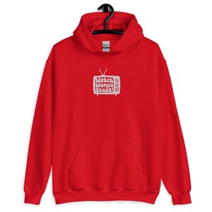 May include: Red hooded sweatshirt with a white graphic of a television screen with the text "Watch Women Score!" printed on it.