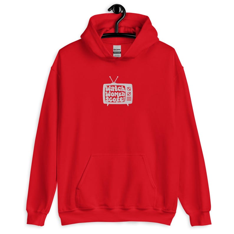 May include: Red hooded sweatshirt with a white graphic of a television screen with the text "Watch Women Score!" printed on it.