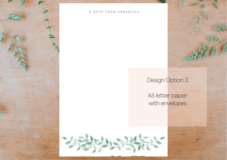 May include: A white notecard with the text "A Note From Arabella" at the top. The notecard has a green leafy border at the bottom. The text "Design Option 3" is in a white box with a peach background. The text below says "A5 letter paper with envelopes".