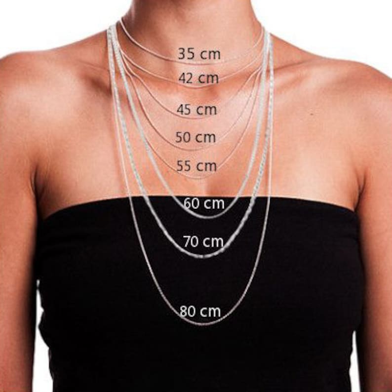 May include: A model wears a silver chain necklace in various lengths, with measurements in centimeters labeled on the image: 35 cm, 42 cm, 45 cm, 50 cm, 55 cm, 60 cm, 70 cm, and 80 cm.