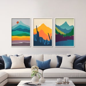 A set off 3 mid century modern wall art prints featuring minimalist colorful mountains.