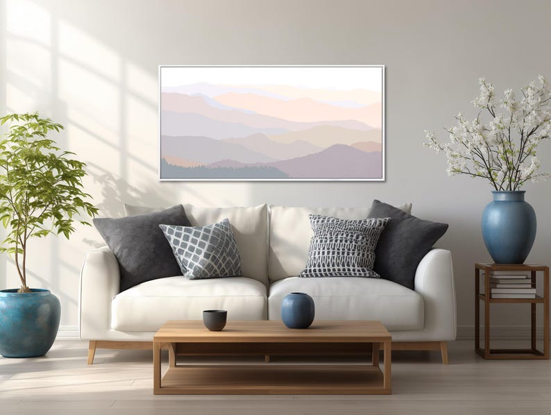 Mountain landscape wall art featuring layered mountain silhouettes in pastel tones and a contemporary minimalist style, presented as wall art framed in a natural wood floating frame.