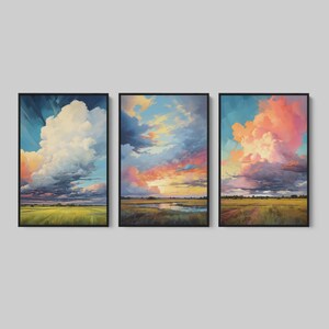 Gallery wall set with three Western storm landscape artworks, bold cloud-filled skies, and wood framed canvas print styling for farmhouse interiors.
