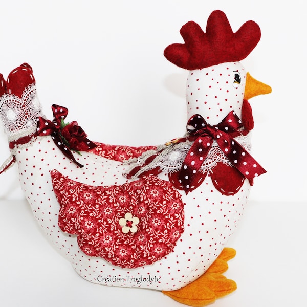 Poule rouge et blanche en tissu, lestée de sable en cale porte ou simplement pour la décoration de cuisine, de salon, d'entrée.