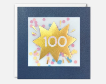 Puede incluir: Una estrella dorada en forma de explosión con el número 100 en texto blanco sobre un fondo blanco con confeti de colores. La estrella está sobre una tarjeta azul marino.