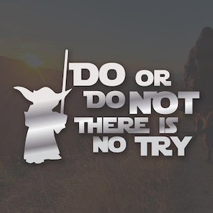 May include: A silver-colored graphic featuring Yoda from Star Wars holding a staff, with the text "DO OR DO NOT THERE IS NO TRY" in silver block letters. The background is a blurred outdoor scene.