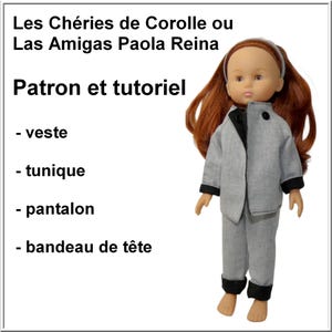 May include: A doll wearing a gray suit with black trim, including a jacket and pants. The doll has red hair and a white headband. The image includes text in French: "Les Chéries de Corolle ou Las Amigas Paola Reina Patron et tutoriel".