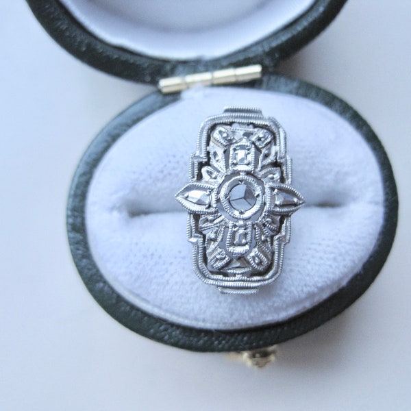 Antique button, silver set with rose cut diamond.