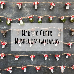Puede incluir: Una guirnalda de setas rojas y blancas con el texto "MADE TO ORDER MUSHROOM GARLANDS" en un rectángulo blanco.