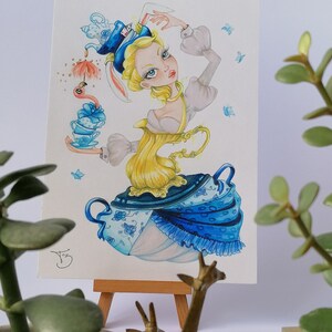 May include: A watercolor painting of a woman dressed in a blue and white teacup dress with a teapot hat. She is holding a teacup and saucer in her hand. The painting is set against a white background.