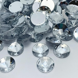 Strass acrilici RIVOLI rotondi sfaccettati da cucire - CRISTALLO - da 8 mm a 18 mm - 2 fori - Cucito