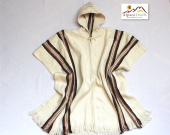 May include: A white alpaca wool poncho with brown and black stripes and a hood. The poncho has fringe around the edges.