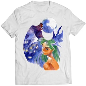 May include: White t-shirt with a graphic print of a woman with green hair and a creature with wings in front of a full moon.
