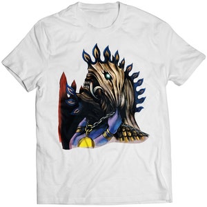 May include: White t-shirt with a colorful illustration of a creature with a crown of flames and a chain around its neck.