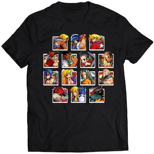 May include: Black t-shirt with a grid of pixelated characters from a video game. The characters are in various poses and have different colored hair and clothing.