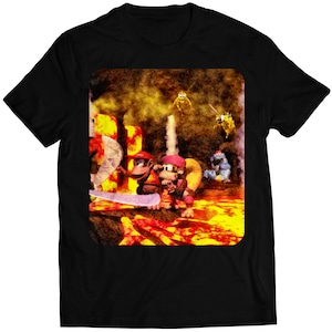 Puede incluir: Una camiseta negra con una imagen colorida de una escena de videojuego. La imagen presenta cuatro personajes, incluyendo un mono, un oso y un pájaro, de pie en una plataforma con un fondo de lava.