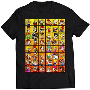 May include: Black t-shirt with a colorful grid of cartoon characters. The characters are all different and have different expressions. The grid is surrounded by a yellow border.