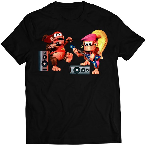 May include: Black t-shirt featuring a cartoon image of two monkeys playing music. One monkey is holding a microphone and the other is playing a guitar. The monkeys are wearing red and blue clothing. The t-shirt has a black background.